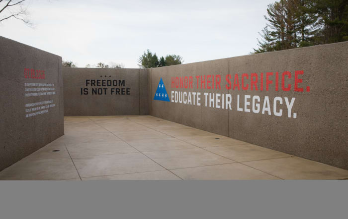 The Folds of Honor mantra, "Honor their sacrifice; Educate their legacy," welcomes visitors to the Memorial Wall.